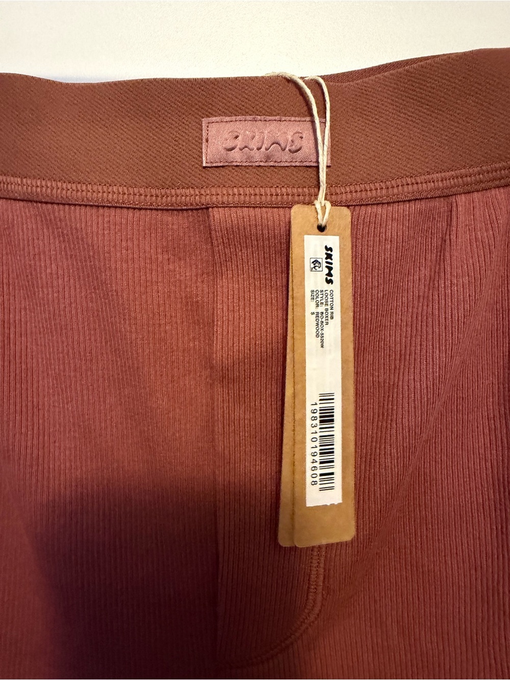 SKIMS Ribbed Athletic Shorts in Rust - Picture 2 of 3